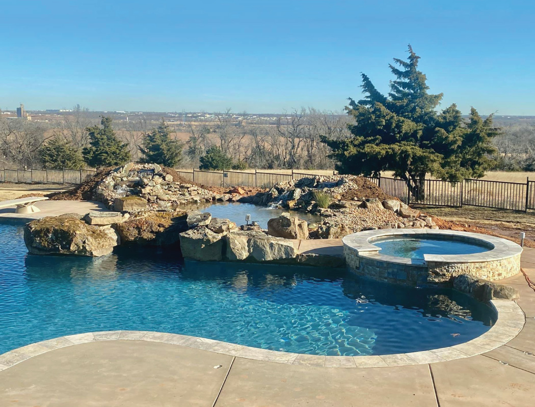 custom designed hot tub and pool by grotto pool designs